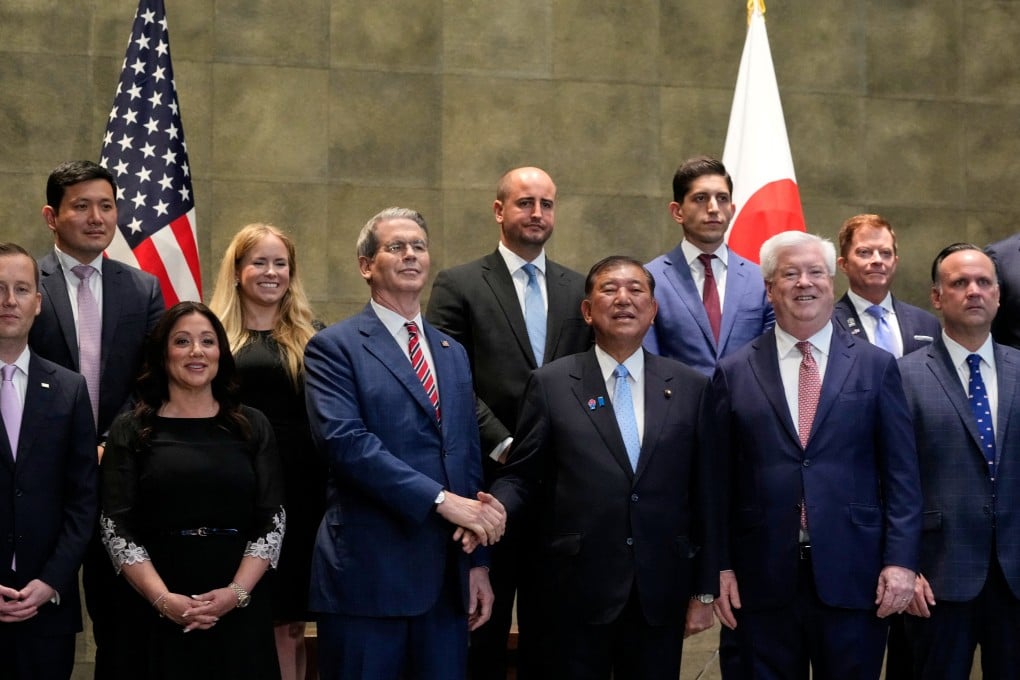 Japanese Prime Minister Shigeru Ishiba shakes hands with US Treasury Secretary Scott Bessent before their meeting in Japan on Friday. Photo: Reuters
