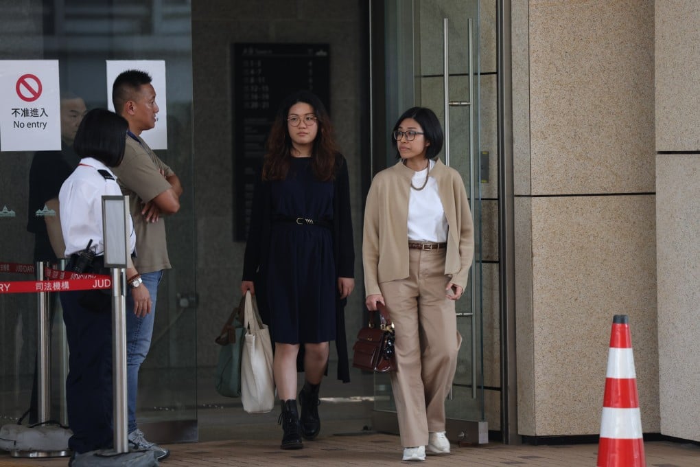 Late taxi driver Chan Fai-wong’s two daughters leave the Coroner’s Court on Thursday. Photo: Brian Wong