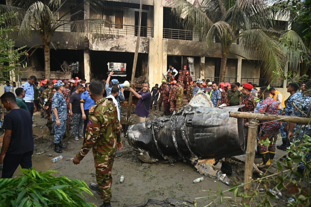 Members of the Bangladesh Army and Fire Service begin rescue operations after a Bangladesh Air Force plane crashed into a school on July 21. Photo: dpa