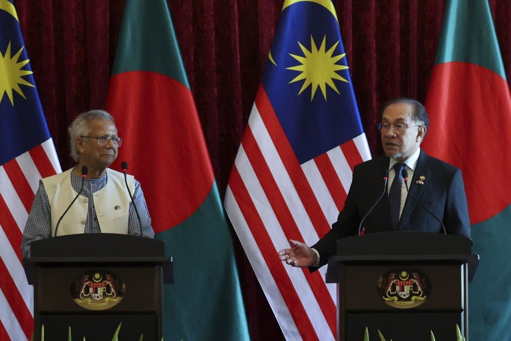 Malaysian Prime Minister Anwar Ibrahim speaks alongside Bangladesh’s interim leader Muhammad Yunus at a press conference in Putrajaya on Tuesday. Photo: EPA