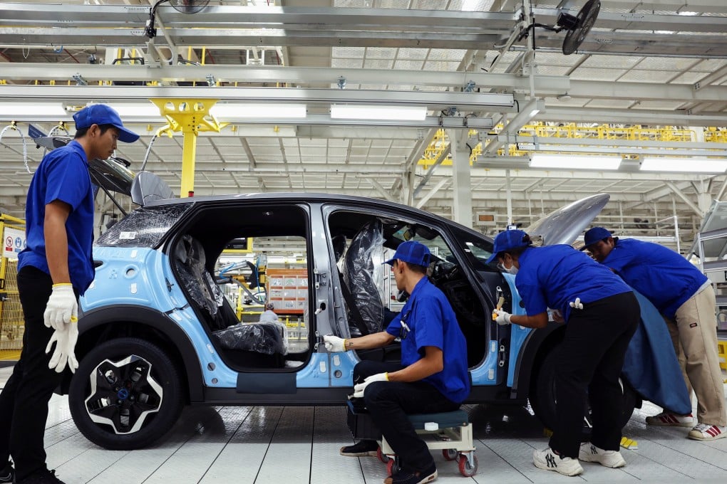 Workers assemble an electric vehicle at Chinese marque BYD’s factory in Rayong, Thailand, in July last year. Photo: Reuters