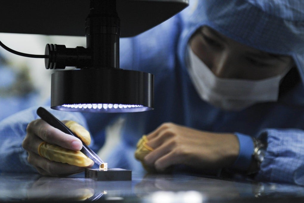 An employee works on a production line for high-speed optical modules for 5G applications at Irixi Photonics in Maanshan, Anhui province, in September 2019. Photo: China News Service/VCG via Getty Images