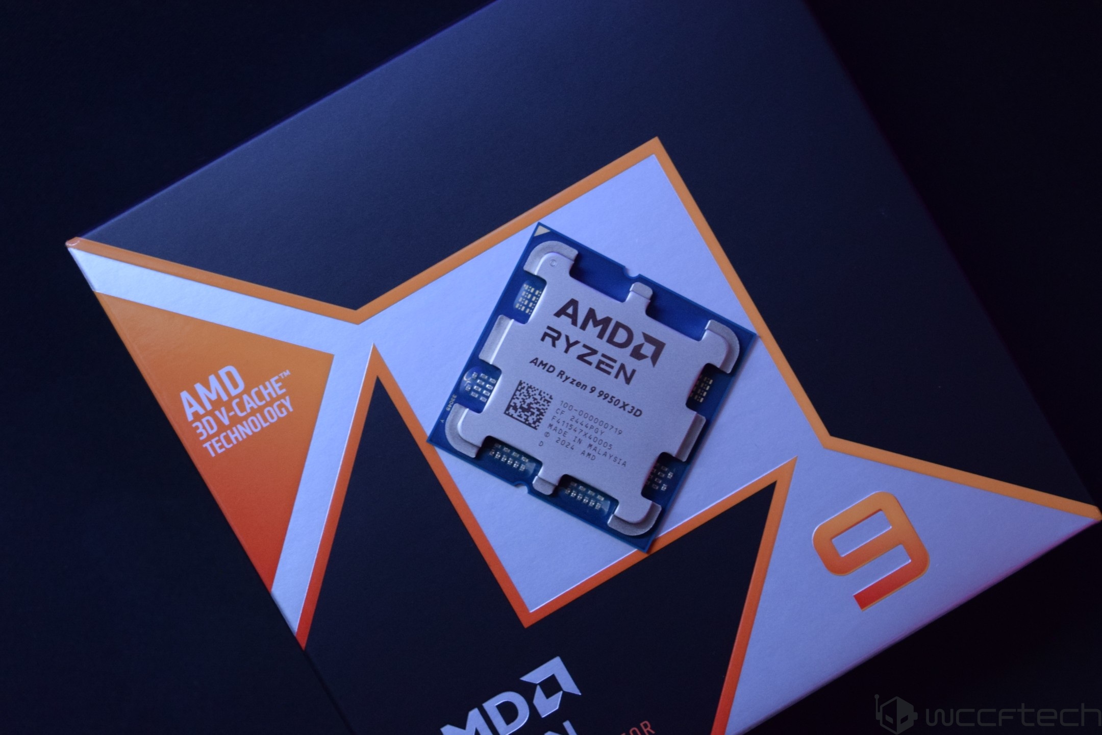 The image shows an AMD Ryzen 9 9950X3D processor with 'AMD 3D V-Cache Technology' displayed on the packaging.