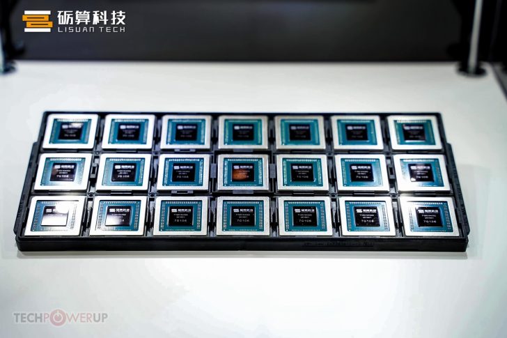 Tray of Lisuan Tech processors displayed on a white surface at TechPowerUp event.