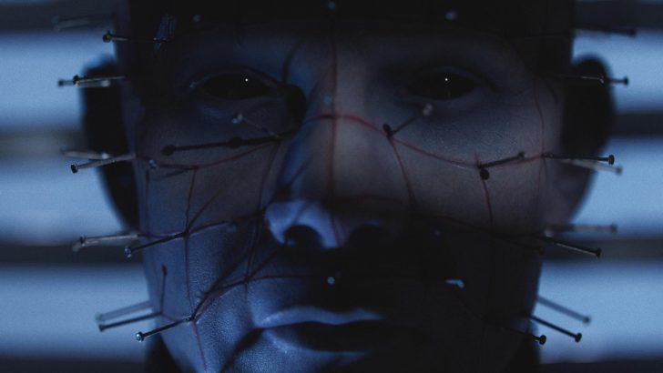 Hellraiser - Dark, mysterious face with pins on a grid pattern creates an eerie, haunting atmosphere.