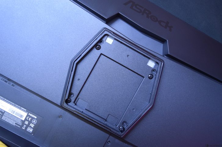 ASRock monitor back with VESA mount bracket, close-up view.