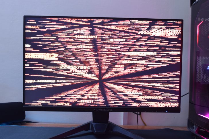 Computer monitor displaying red numeric data patterns.
