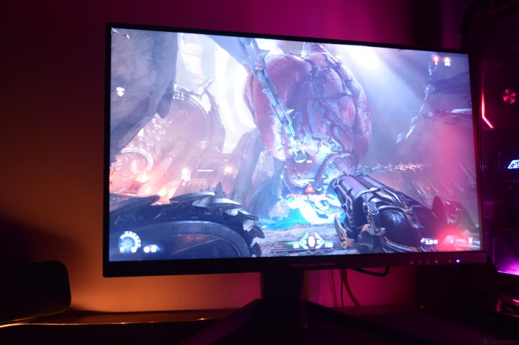 Gaming monitor displaying action-packed video game scene.