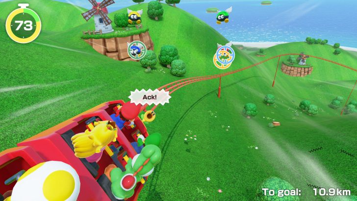 Colorful game scene with characters on a roller coaster in a vibrant green landscape.