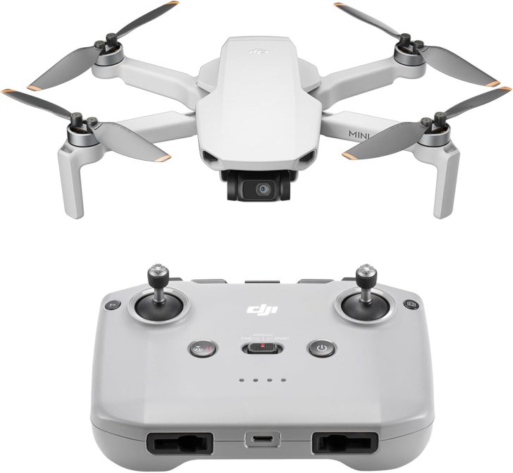 Compact drone with controller, featuring four propellers, ideal for aerial photography.