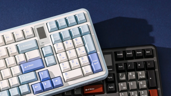 Mechanical keyboards with blue and black keycaps on a blue surface.