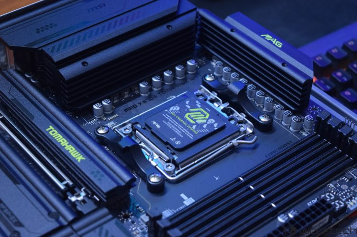 Close-up of a high-performance PC motherboard with CPU socket, heatsinks, and RAM slots.