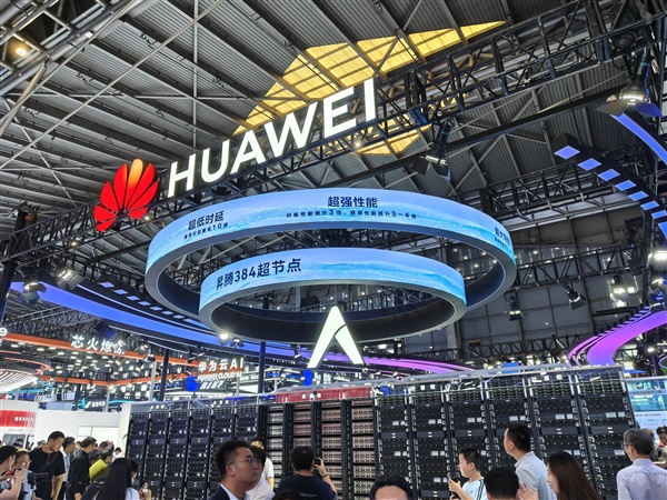 Huawei tech showcase with digital displays and attendees at a bustling event exhibition.