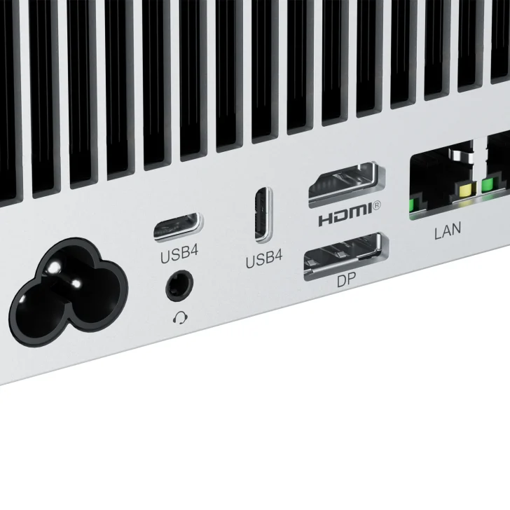 Close-up of computer ports: USB4, HDMI, DisplayPort, LAN connection on a metallic surface.