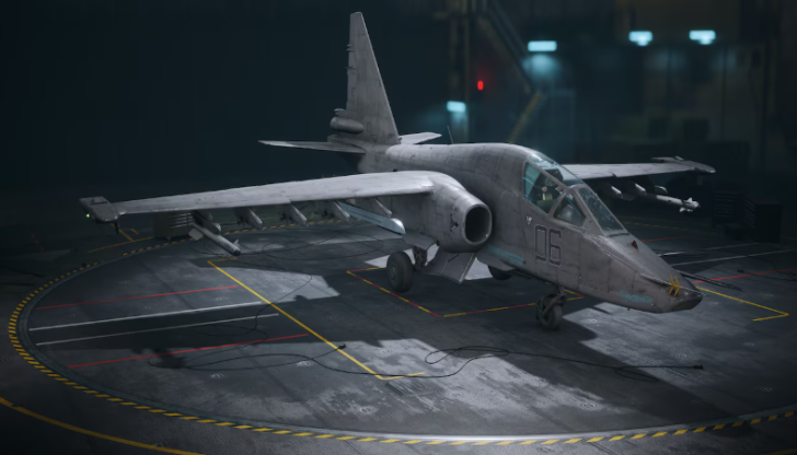 Close-up of a military aircraft on a concrete runway inside a hangar, showcasing its sleek design.