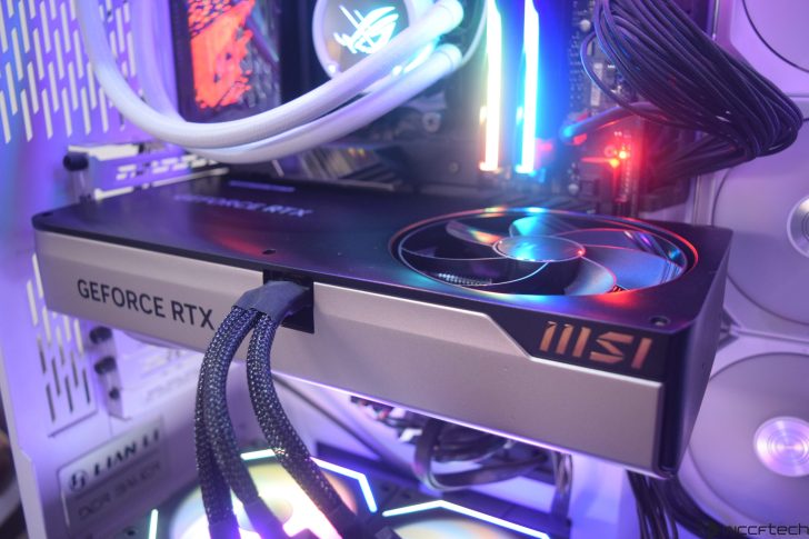 Close-up of GeForce RTX graphics card installed in a PC with RGB lighting and cooling system.