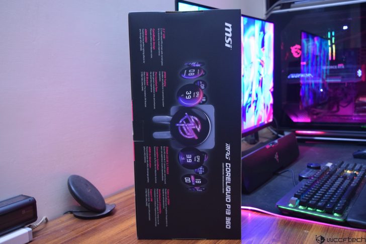 Box of MSI CoreLiquid P360 on a desk with gaming PC and accessories.