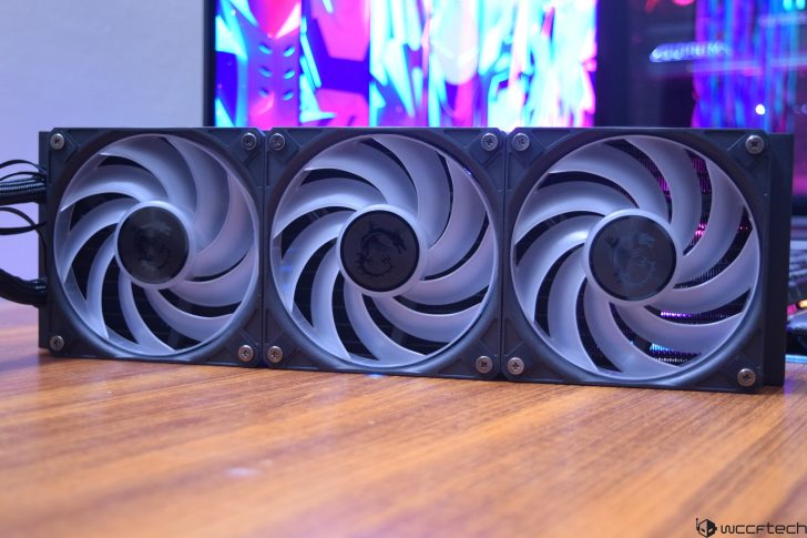High-performance cooling fans with sleek design on a wooden surface.