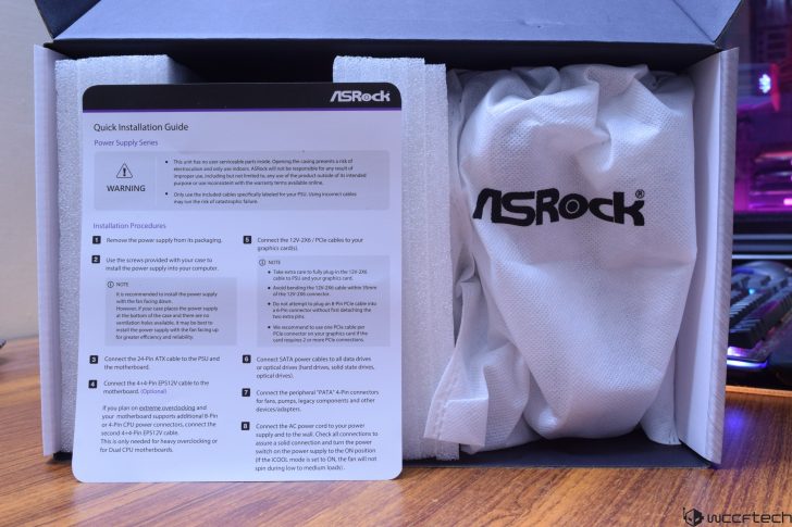 ASRock Power Supply Quick Installation Guide in box with branded packaging.