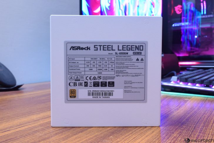 ASRock Steel Legend power supply SL-1200GW, 80 Plus Gold, on a desk by a gaming setup.