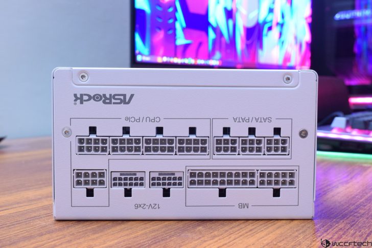Back view of ASRock power supply showing labeled connectors for CPU, PCIe, SATA, and motherboard.