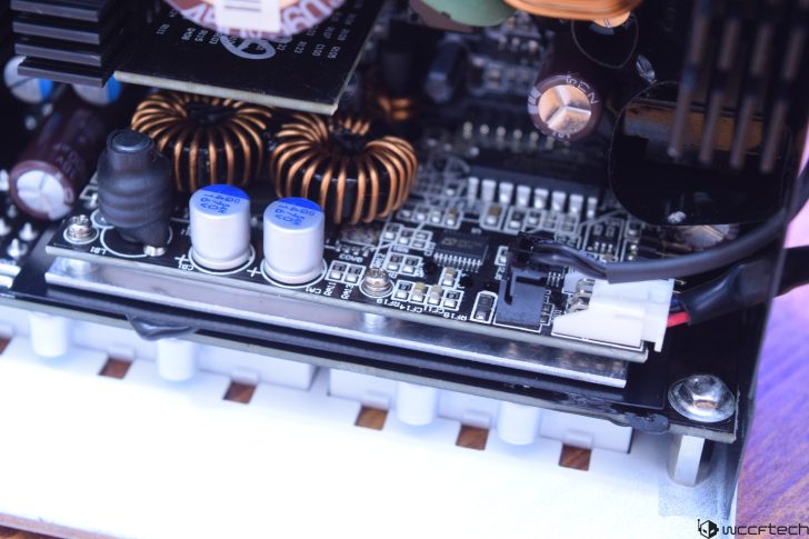 Close-up view of a computer motherboard with capacitors and coils.