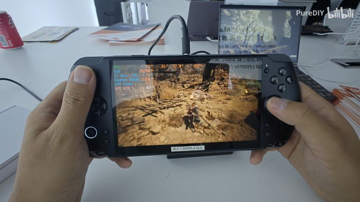 Handheld gaming console showing game and performance stats on screen.