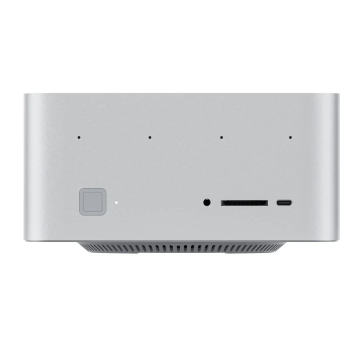 Compact silver desktop computer with multiple front ports and sleek design.