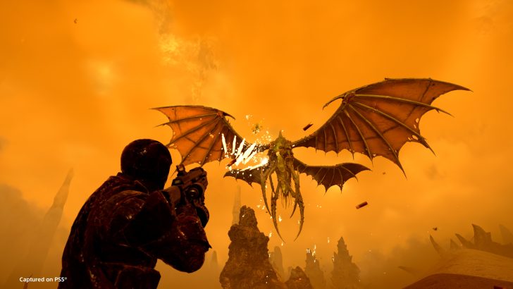 Gamer battles flying dragon in orange sky action scene, captured on PS5.