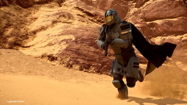 Futuristic armored soldier running in a desert landscape.