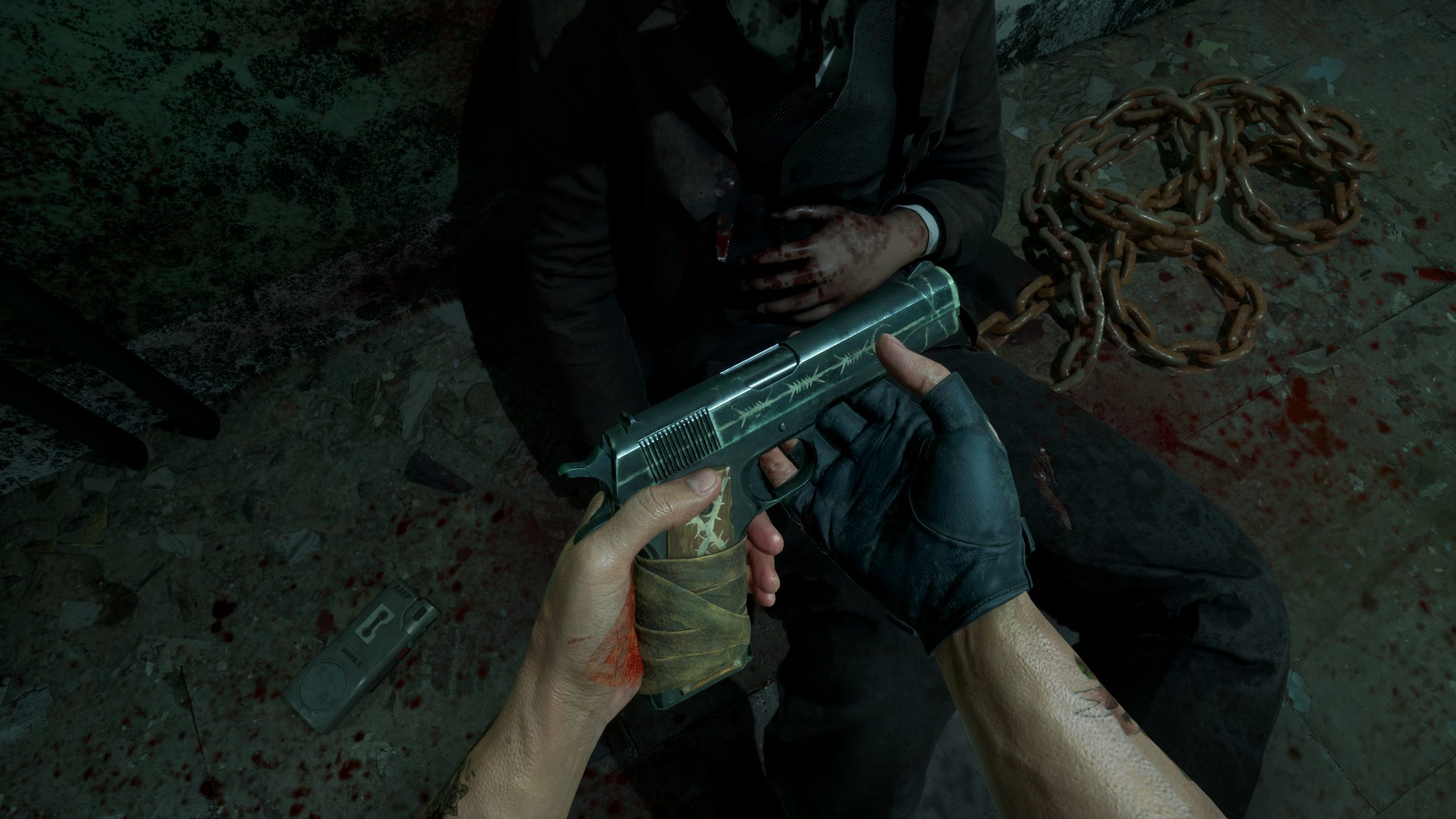 Man holding gun in a dark, gritty setting with chains and bloodstains on the ground.
