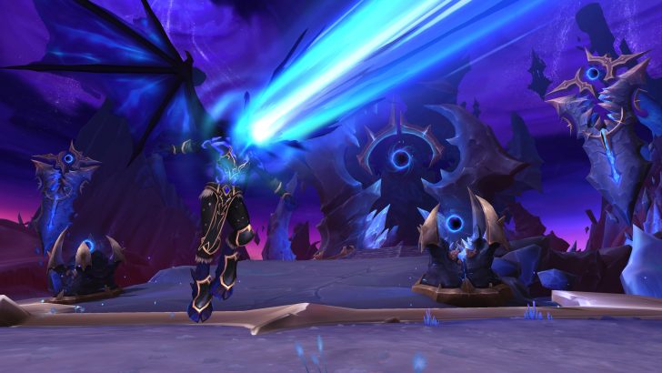 Fantasy mage casting powerful blue spells in a mystical, otherworldly realm.