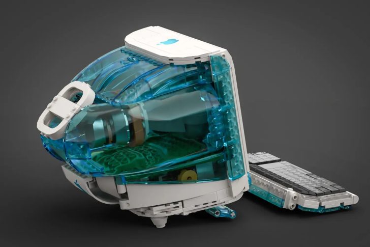 LEGO model resembling a retro Apple iMac with a detached keyboard on a gray background.