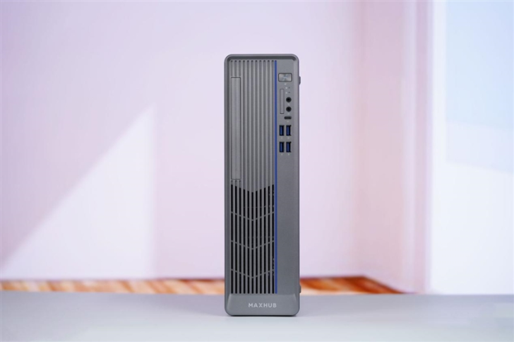 Compact Maxhub desktop PC with vertical design in minimalist workspace.