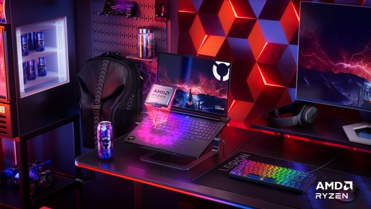 Lenovo Legion laptop with AMD Ryzen 5000 Series CPU on a gaming desk with RGB keyboard and Legion energy drink can.