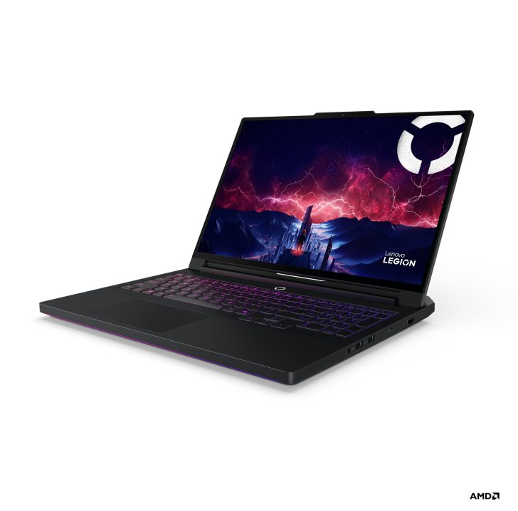 Lenovo Legion gaming laptop with AMD branding, showing a vivid mountain scene on the screen.