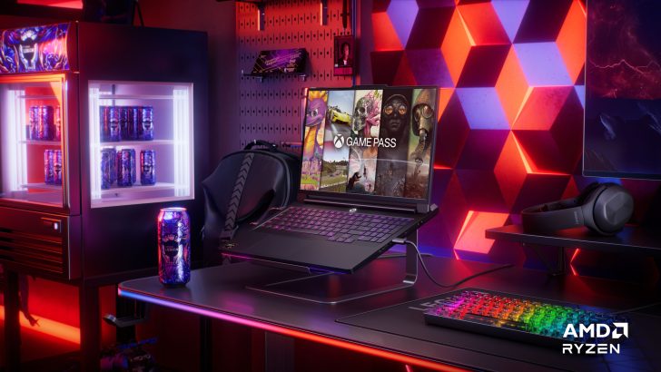 Lenovo Legion laptop displaying Game Pass on desk with AMD Ryzen branding and Legion can in gaming setup.