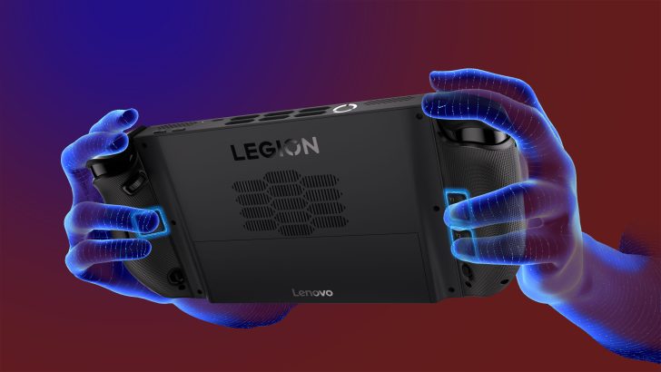 Lenovo Legion device held by glowing digital hands with Legion and Lenovo visible on the back.