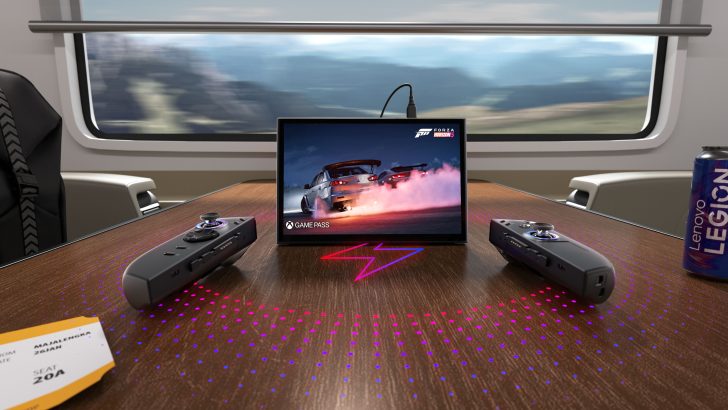 Lenovo Legion can and a screen displaying Forza Horizon 5 with Game Pass logo on train table with controllers.