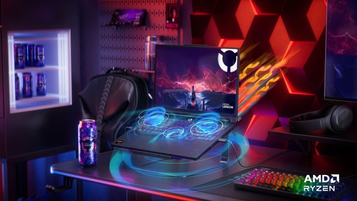 Lenovo Legion laptop on desktop with AMD Ryzen logo and Legion beverage cans nearby.