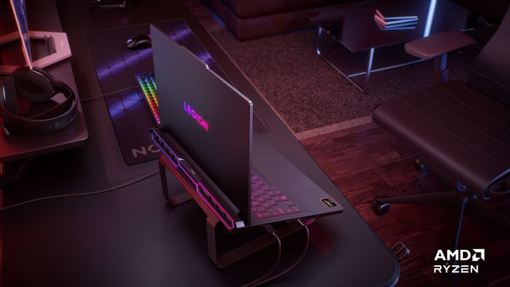 Lenovo Legion laptop on a desk with LEGION lit on the back and AMD Ryzen text in the corner.