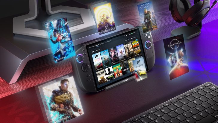 Lenovo Legion gaming handheld displaying game library and titles like Forza Horizon 5, next to headphones and keyboard.