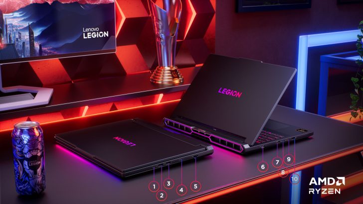 Lenovo Legion laptops on a gaming desk with AMD Ryzen branding and a Lenovo Legion-themed energy drink can.