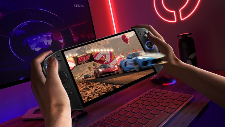 Lenovo Legion Go handheld with racing game on screen in gaming setup.