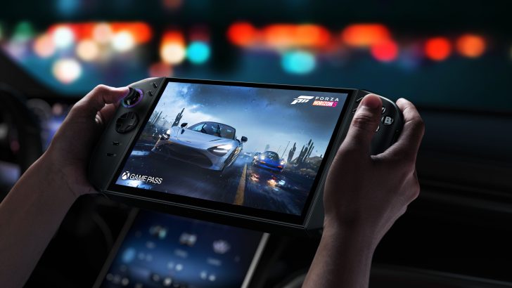 Portable gaming device showing “Forza Horizon 5” with Xbox Game Pass logo in a car.