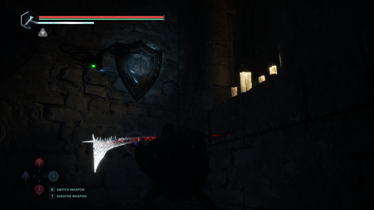 A video game shows a character holding a glowing weapon next to a stone wall with lit candles and UI text reading switch weapon and sheathe weapon.