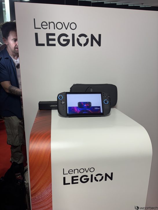 Lenovo Legion gaming device displayed on a stand with a Lenovo Legion screen.