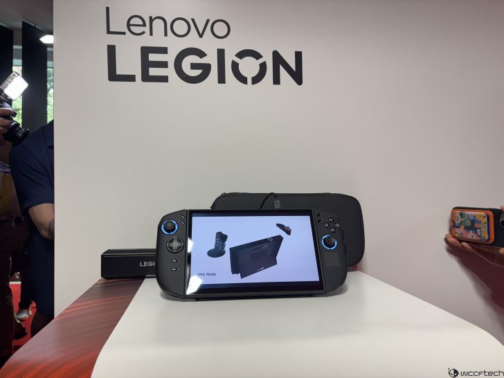 Lenovo Legion gaming handheld displaying FPS Mode on a presentation table.