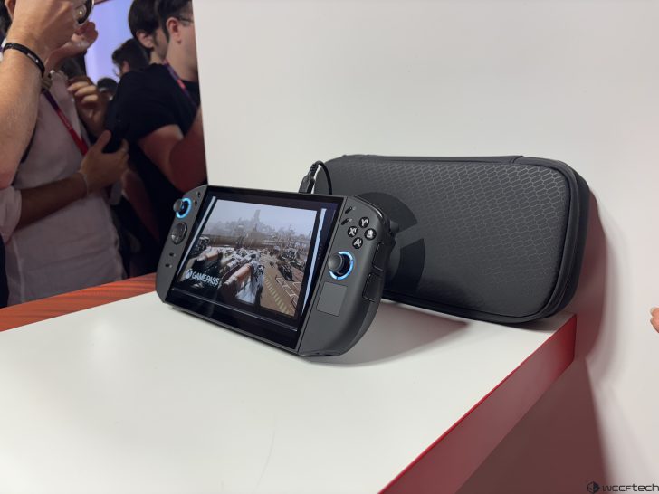 ASUS ROG Ally handheld console with Xbox Game Pass on screen, displayed on a table with carrying case nearby.