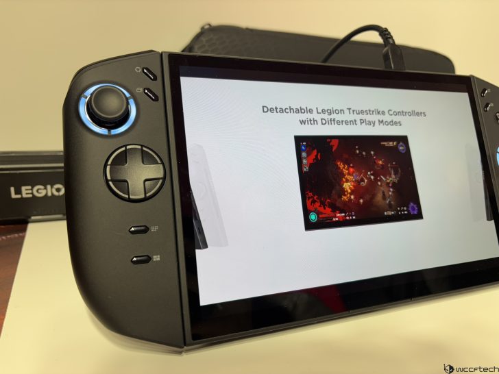 Lenovo Legion gaming device with screen displaying Detachable Legion Truestrike Controllers and a video game interface.
